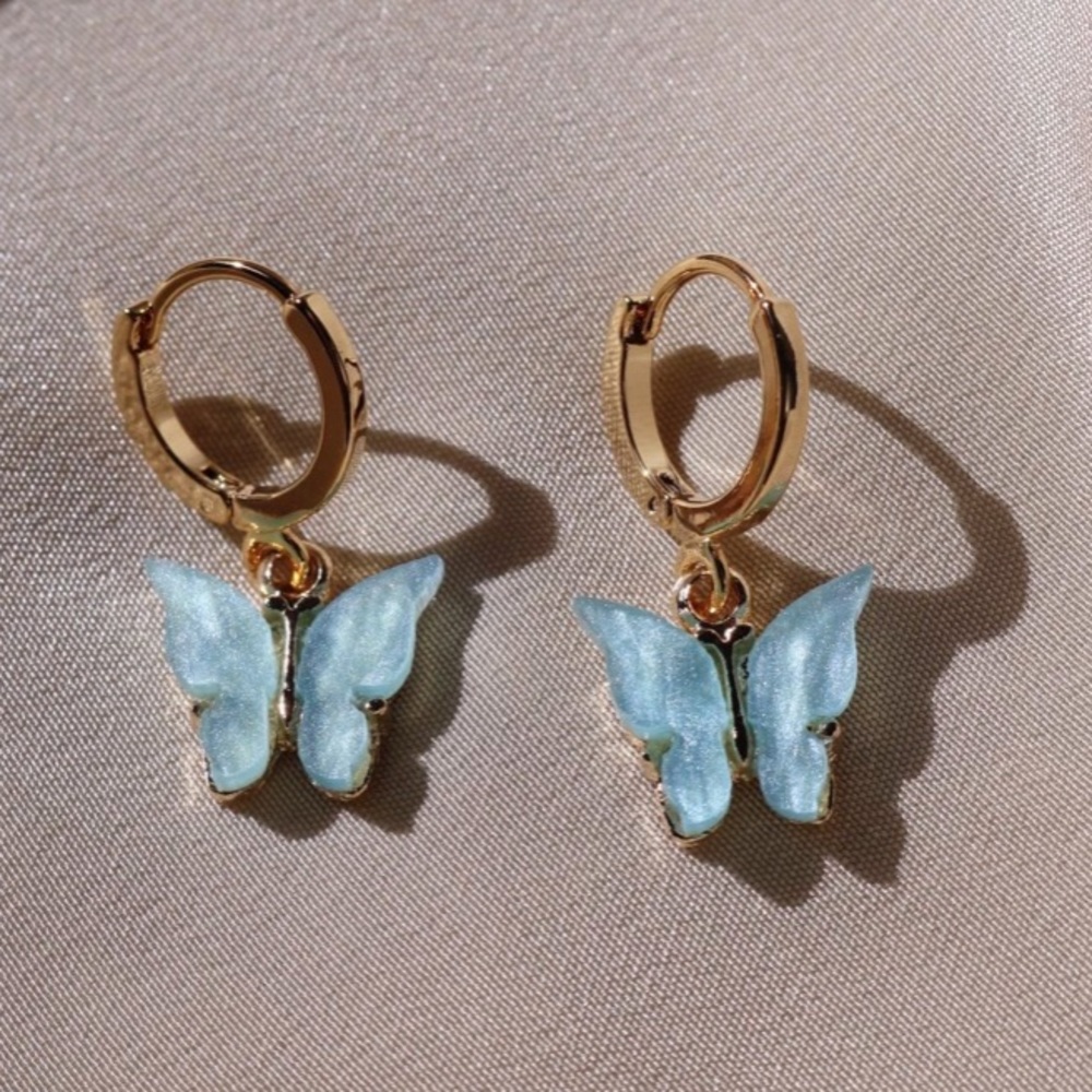 Acrylic baby blue butterfly Huggie earrings